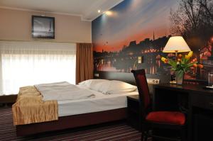 Postel nebo postele na pokoji v ubytování Hotel Atrium