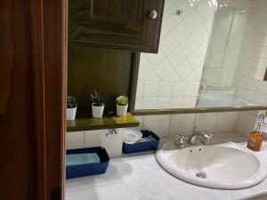 a bathroom with a sink and a mirror at CASA LUCIO in Grosseto +43 photos