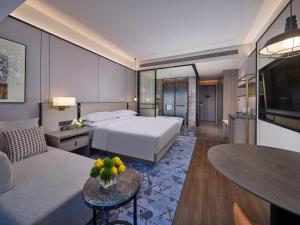 Voodi või voodid majutusasutuse Doubletree By Hilton Anshan toas
