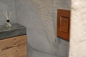 a bathroom with a sink and a wooden counter at Appartement der Extraklasse mit Whirlpool in Roding