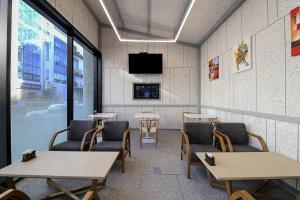 TV a/nebo společenská místnost v ubytování GwangJu Gwangsangu Hanam HoundHotel + 2 fotografie