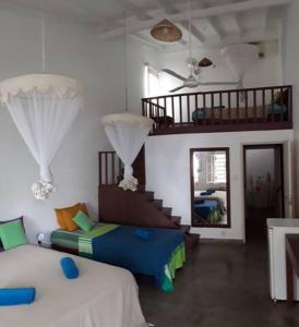 Un pat sau paturi într-o cameră la Palm villa Mirissa hotel&spa