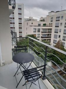 a chair sitting on the balcony of a building at Studio With Balcony In Issy Les Moulineaux in Issy-les-Moulineaux