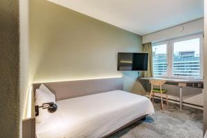 Postel nebo postele na pokoji v ubytování flexymotel Wil