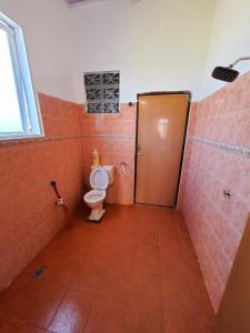 a bathroom with a toilet and a shower stall at Homestay Kuala Terengganu One Stop 1 in Kuala Terengganu
