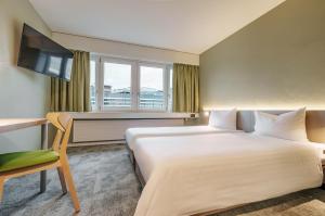Postel nebo postele na pokoji v ubytování flexymotel Wil