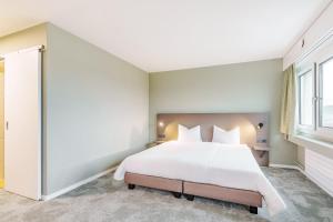 Postel nebo postele na pokoji v ubytování flexymotel Wil