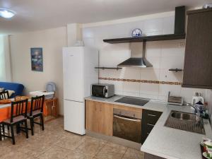 Kuchyň nebo kuchyňský kout v ubytování Apartamento Zona Rural + 17 fotografií