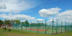 a batting cage on a baseball field at Miejsko Gminny Ośrodek Sportu i Rekreacji in Łopuszno +1 photo