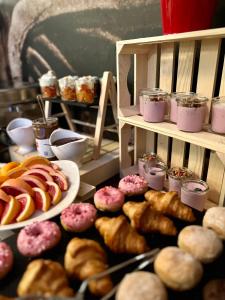 a display of different types of donuts and pastries at Hotel Nosal Ski & Wine in Zakopane