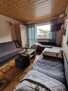 Posteľ alebo postele v izbe v ubytovaní Dom Gościnny Hanna