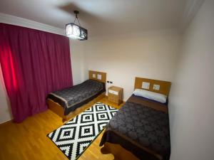 Ένα ή περισσότερα κρεβάτια σε δωμάτιο στο Tiba gardens - men only