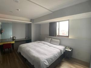 Letto o letti in una camera di Bonjour Hotel