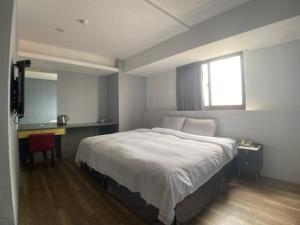 Letto o letti in una camera di Bonjour Hotel