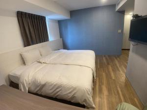 Letto o letti in una camera di Bonjour Hotel