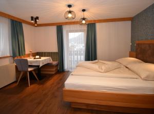 A bed or beds in a room at Haus Hubertus