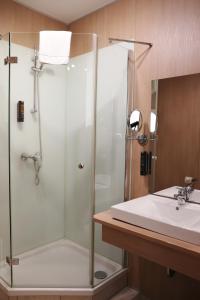 a bathroom with a shower and a sink at Hotel Blie, Bed & Breakfast, Self Check-in in Horn