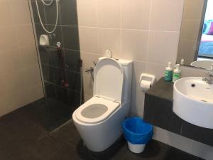 a bathroom with a toilet and a sink at Ellkay Studio Suite at Evo Bangi in Kampong Sungai Ramal Dalam