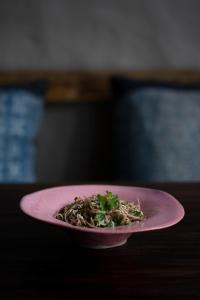 a pink plate of food on a table at Dechiu in Hoi An