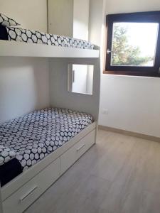 A bed or beds in a room at Affittimoderni Avola La Perla