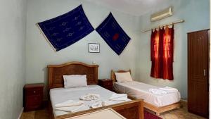 Postel nebo postele na pokoji v ubytování Hotel Riad Oasis