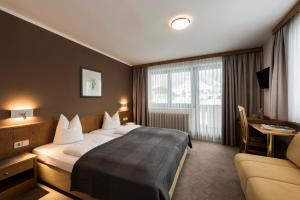 Postel nebo postele na pokoji v ubytování Hotel Medrazerhof + 37 fotografií