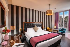 Ліжко або ліжка в номері Navona Colors Hotel