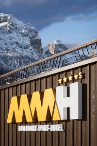 a sign for the mwssnow family arctic hotel at Movi Family Apart-Hotel ****s in Corvara in Badia