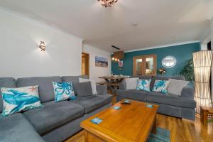 a living room with a couch and a table at Trevelyan in St Ives