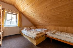 Postel nebo postele na pokoji v ubytování Vakantiehuis Cerny Dul 38