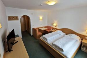 Posteľ alebo postele v izbe v ubytovaní Hotel la Plaza