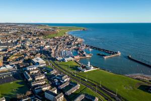 an aerial view of a city next to the ocean at Sea View Luxury Apartment 3 bedrooms Free Parking - By Coast Apartments in Arbroath