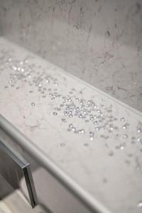 a shower with water droplets on the edge of a tub at Sea View Luxury Apartment 3 bedrooms Free Parking - By Coast Apartments in Arbroath
