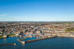 an aerial view of a harbor with boats in the water at Sea View Luxury Apartment 3 bedrooms Free Parking - By Coast Apartments in Arbroath