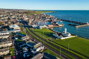 an aerial view of a city with a harbor at Sea View Luxury Apartment 3 bedrooms Free Parking - By Coast Apartments in Arbroath
