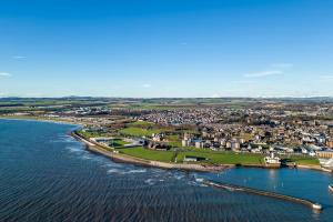 an aerial view of the shoreline of a town next to the water at Sea View Luxury Apartment 3 bedrooms Free Parking - By Coast Apartments in Arbroath