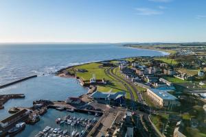 an aerial view of a harbor with boats in the water at Sea View Luxury Apartment 3 bedrooms Free Parking - By Coast Apartments in Arbroath