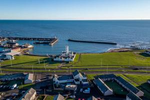 an aerial view of a harbor with the ocean at Sea View Luxury Apartment 3 bedrooms Free Parking - By Coast Apartments in Arbroath