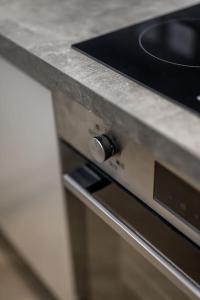 a close up of a stove in a kitchen at Sea View Luxury Apartment 3 bedrooms Free Parking - By Coast Apartments in Arbroath