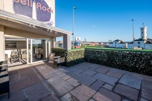 a patio in front of a building at Sea View Luxury Apartment 3 bedrooms Free Parking - By Coast Apartments in Arbroath