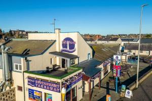 an overhead view of a building in a city at Sea View Luxury Apartment 3 bedrooms Free Parking - By Coast Apartments in Arbroath