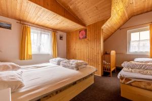 Postel nebo postele na pokoji v ubytování Vakantiehuis Cerny Dul 38