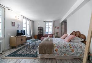 Un ou plusieurs lits dans un hébergement de l'établissement Résidence Aristide Briand - Appartements en Centre Ville