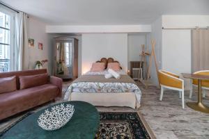 Un ou plusieurs lits dans un hébergement de l'établissement Résidence Aristide Briand - Appartements en Centre Ville
