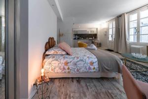 Un ou plusieurs lits dans un hébergement de l'établissement Résidence Aristide Briand - Appartements en Centre Ville