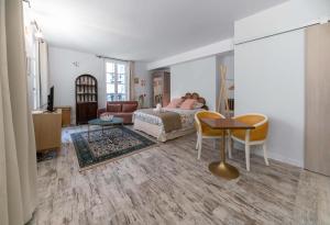 Un ou plusieurs lits dans un hébergement de l'établissement Résidence Aristide Briand - Appartements en Centre Ville