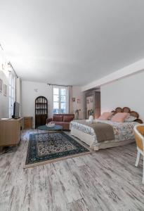 Un ou plusieurs lits dans un hébergement de l'établissement Résidence Aristide Briand - Appartements en Centre Ville