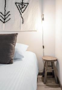 Un ou plusieurs lits dans un hébergement de l'établissement Résidence Aristide Briand - Appartements en Centre Ville