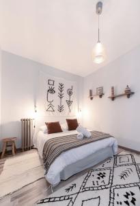 Un ou plusieurs lits dans un hébergement de l'établissement Résidence Aristide Briand - Appartements en Centre Ville