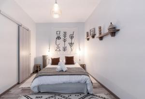 Un ou plusieurs lits dans un hébergement de l'établissement Résidence Aristide Briand - Appartements en Centre Ville